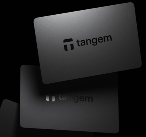 Three Tangem cards fanned out — card form factor compared to a standard credit card for scale
